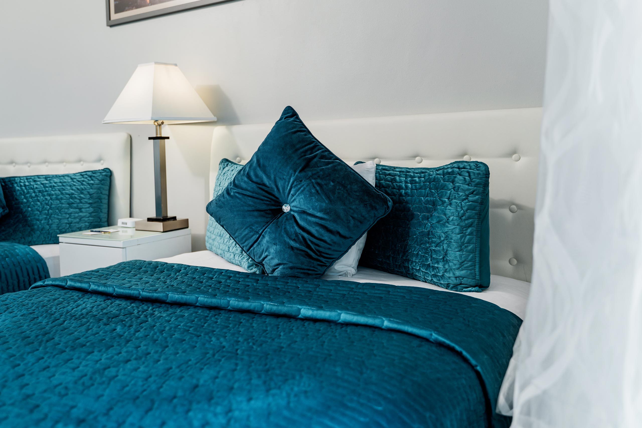 Blue decorative pillows and lamp